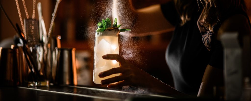 Bartender serving premium drinks or cocktails